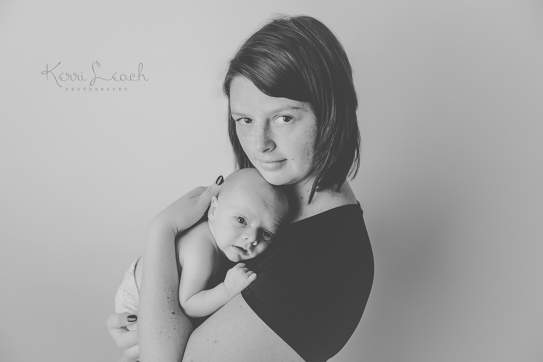 Kerri Leach Photography-Evansville IN newborn photographer-Newborn poses-Newborn bean bag-Newborn photography-parent posing