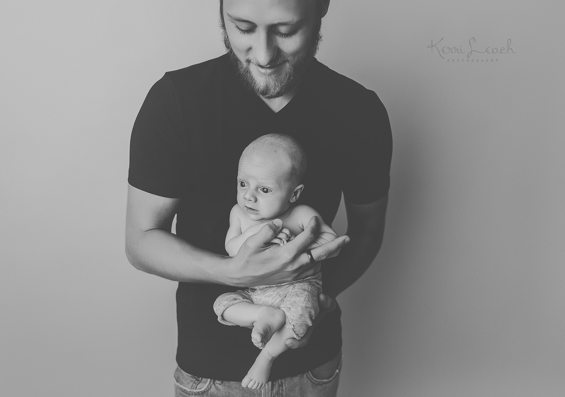 Kerri Leach Photography-Evansville IN newborn photographer-Newborn poses-Newborn bean bag-Newborn photography-parent posing
